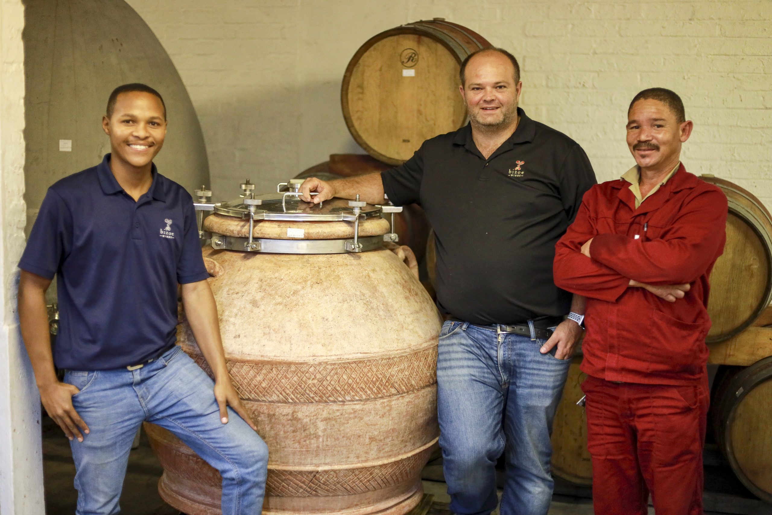 Elton, Rikus and Jannie in the cellar